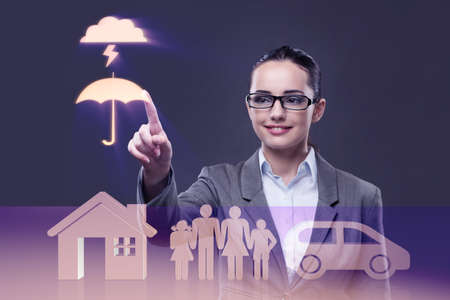 Young businesswoman in insurance conceptの写真素材