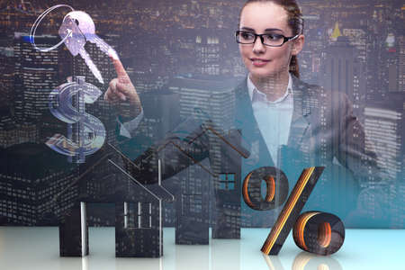 Businesswoman in housing mortgage conceptの写真素材