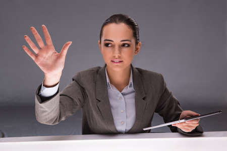 Woman with tablet computer in business conceptの写真素材
