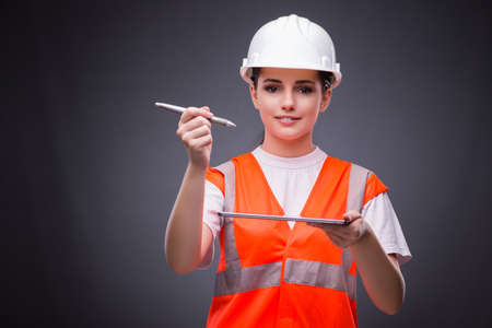Young construction worker with tablet computer