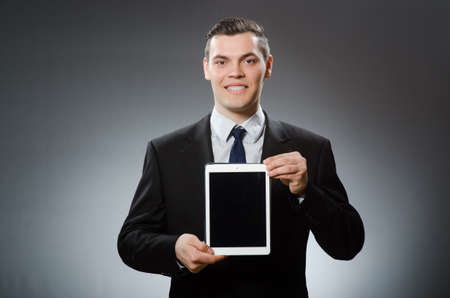 Businessman using his tablet computer in business conceptの写真素材