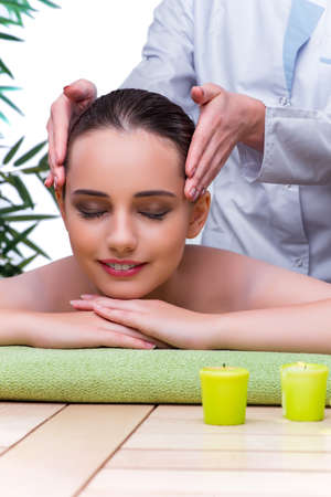Woman during massage session in spa salonの写真素材