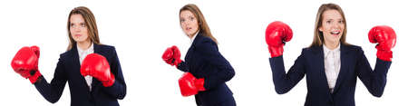 Woman businesswoman with boxing gloves on whiteの写真素材
