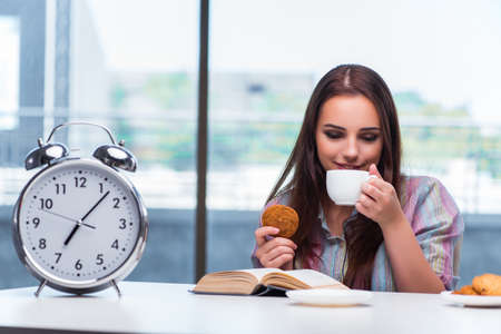 Young girl having breakfast on the morningの写真素材