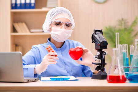 Young woman doctor working in the lab