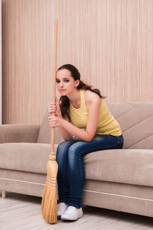 Young woman doing cleaning at homeの写真素材