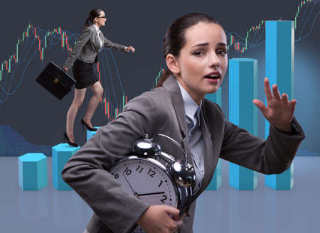 Businesswoman climbing career ladder as trader brokerの写真素材