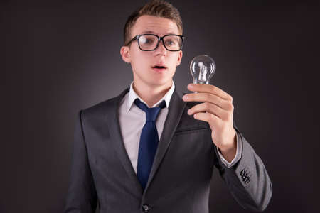 Young businessman with light bulb in idea conceptの写真素材