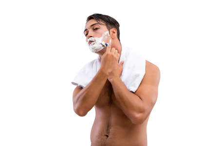 Handsome man shaving isolated on white backgroundの写真素材