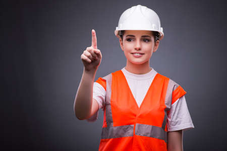 Cute construction worker pressing virtual buttons