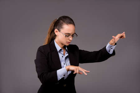 Young woman businesswoman pressing virtual buttons