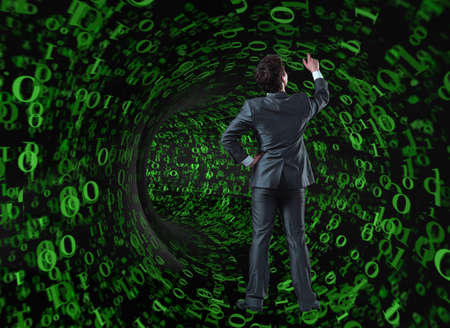 Businessman against the funnel made of binary numbersの写真素材