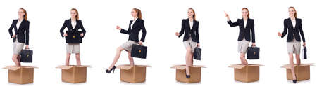Businesswoman with boxes isolated on whiteの写真素材