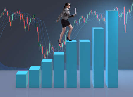 Businesswoman climbing career ladder as trader brokerの写真素材