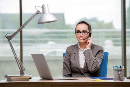 Call center operator working at her desk