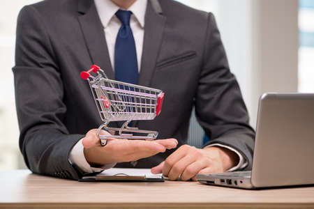 Businesswoman with shopping cart trolley