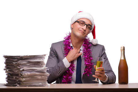 Young businessman celebrating christmas in officeの写真素材