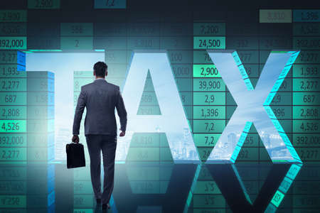 Businessman in high taxes conceptの写真素材
