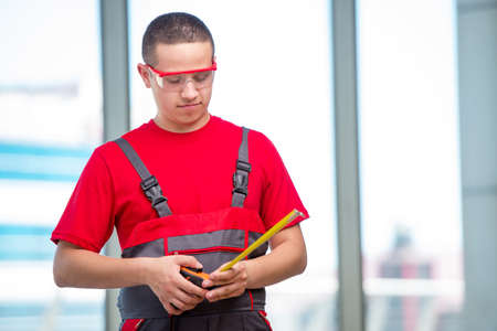 Young furniture carpenter in industrial concept