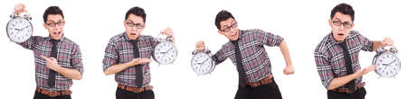 Young man with clock isolated on whiteの写真素材
