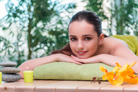 Young beautiful woman during spa procedureの写真素材