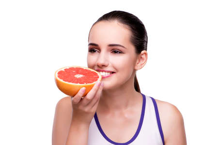 Woman with grapefruit isolated on whiteの写真素材
