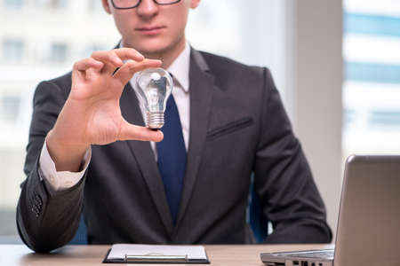 Businessman with light bulb in idea concept