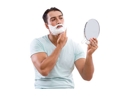 Handsome man shaving isolated on white background