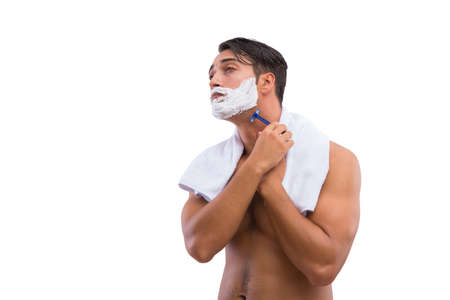 Man shaving isolated on the white backgroundの写真素材