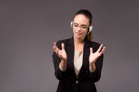 Young woman businesswoman pressing virtual buttonsの写真素材