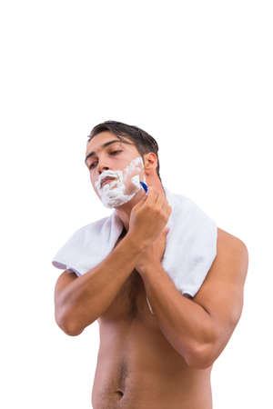Man shaving isolated on the white backgroundの写真素材