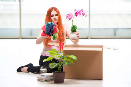 Young woman moving house in lifestyle concept