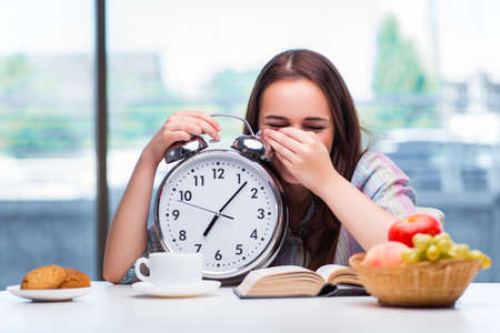 Young girl having breakfast on the morningの写真素材