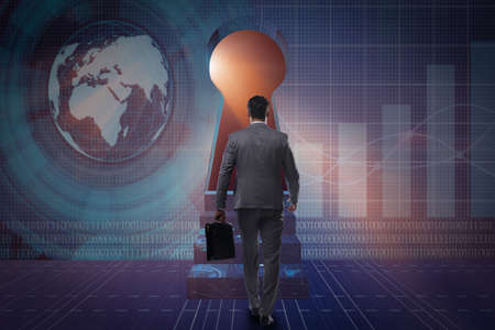 Businessman facing keyhole in business conceptの写真素材