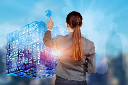 Businesswoman in business concept with finance cubeの写真素材