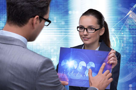 Business people discussing stock chart trendsの写真素材