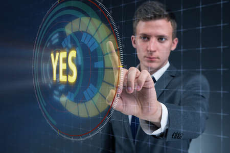 Businessman pressing virtual button YESの写真素材