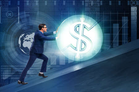 Businessman pushing away dollar ballの写真素材