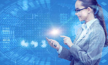 Businesswoman with mobile in business conceptの写真素材