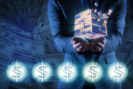 Businessman holding financial cube in business conceptの写真素材