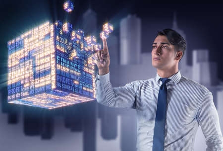 Businessman pressing virtual buttons in conceptの写真素材