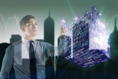 Businessman pressing virtual buttons in concept
