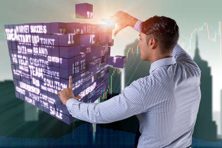 Businessman pressing virtual buttons in conceptの写真素材