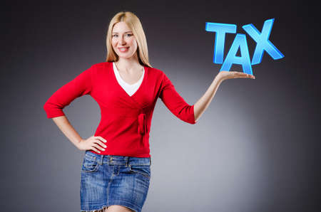 Businesswoman in tax business conceptの写真素材