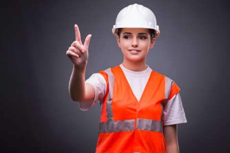 Cute construction worker pressing virtual buttons