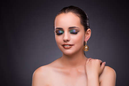 Beautiful woman with jewellery in beauty conceptの写真素材