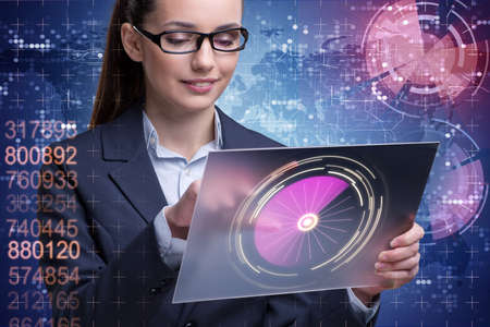 Businesswoman with tablet in business conceptの写真素材