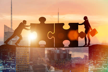 Business concept of teamwork with jigsaw puzzleの写真素材