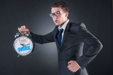 Young businessman in business time conceptの写真素材
