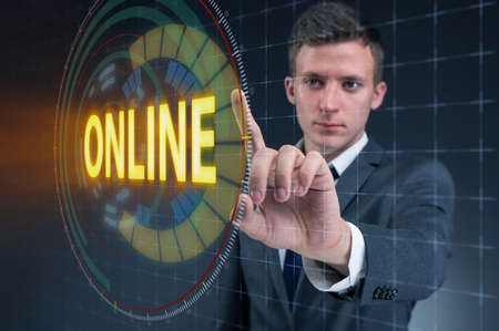 Businessman pressing virtual button onlineの写真素材